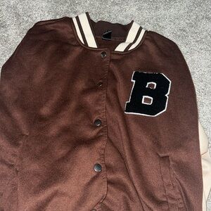 Brown and tan varsity jacket